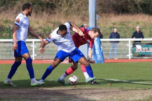 IMG 7715-Xavier-Benjamin-tussles-with-Taylor-Maloney-watched-by-Hisham-Kasimu