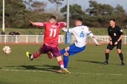 IMG 7749-Jack-Wood-tries-to-block-a-shot-from-Jack-Bates