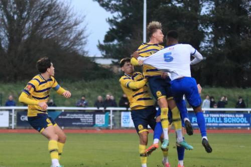 IMG 6106-Torquays-Cody-Cooke-heads-clear-from-Xavier-Benjamin