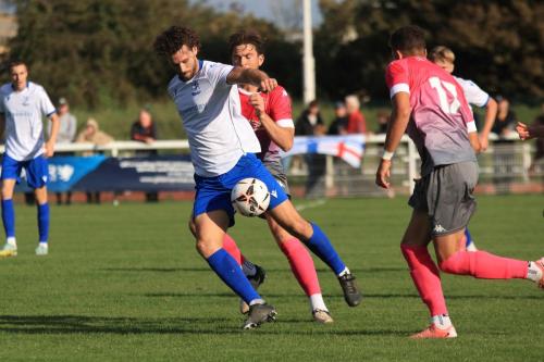 IMG 4401-Harry-Ottaway-shields-the-ball-from-Leo-Hamblin