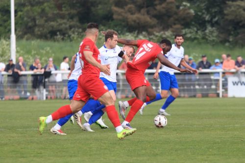 IMG 9833-Worthings-Temi-Babalola-tries-to-escape-the-clutches-of-Mickey-Parcell