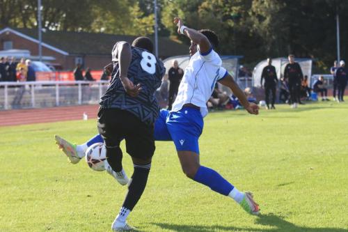 IMG 4647-John-Oyenuga-R-tries-to-block-a-clearance-from-Hamza-Semakula