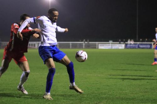 IMG 7283-Hisham-Kasimu-shields-the-ball-from-Riccardo-Di-Trolio