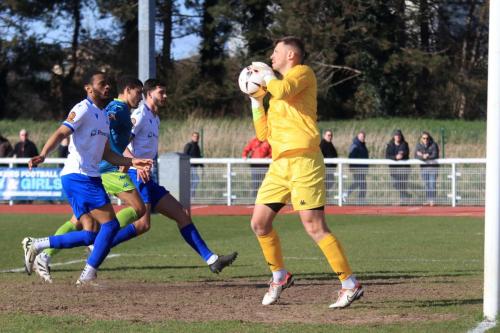 IMG 8520-Truros-Dan-Lavercombe-collects-the-ball-ahead-of-l-r-Hisham-Kasimu-Christian-Oxlade-Chamberlain-and-Henry-Hawkins