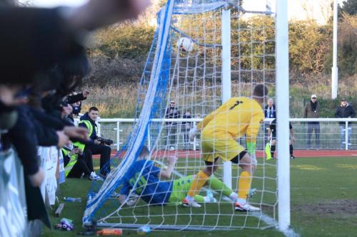 IMG 8786-Keeper-Dan-Lavercombe-and-defender-Ryan-Law-cant-keep-Ollie-Knights-shot-out-of-the-goal