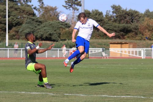 IMG 0953-Enfields-Ruaridh-Donaldson-heads-the-ball-past-Ryan-Jackson