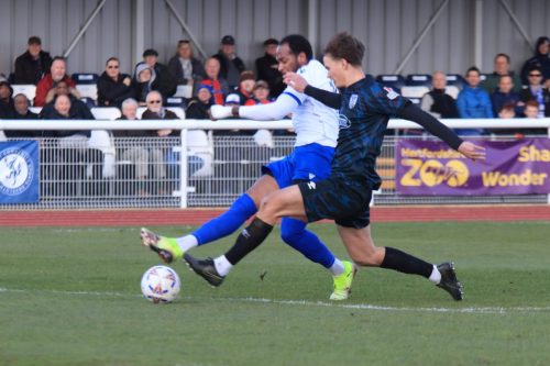 IMG 4495-Lamar-Reynolds-shoots-despite-the-efforts-of-Will-Lannin-Sweet-to-block