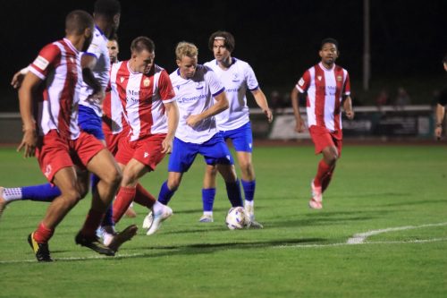 IMG 0594-The-ball-lands-at-the-feet-of-Adam-Thompson-but-he-cant-get-a-clear-shot