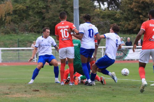 IMG 0189-The-Maidenhead-defence-scrambles-the-ball-clear-as-Sam-Youngs-challenges