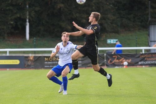 IMG 1154-Jake-Hicks-heads-clear-from-Billly-Leonard