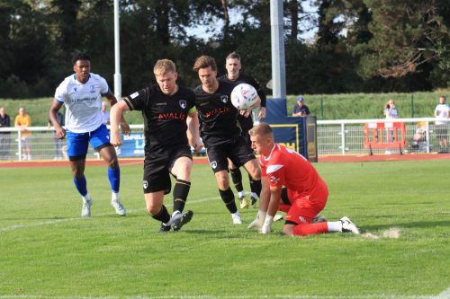 IMG 1313-Emlyn-Lewis-clears-just-ahead-of-keeper-Max-Harris