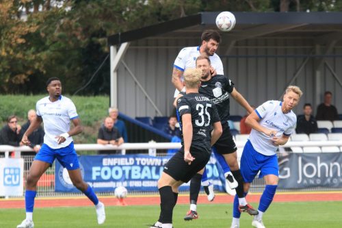 IMG 1359-Enfields-Henry-Hawkins-wins-a-header-against-Reece-Fleet