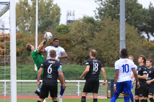 IMG 1383-Bayley-Brown-is-penalised-for-a-foul-on-keeper-Will-Henry