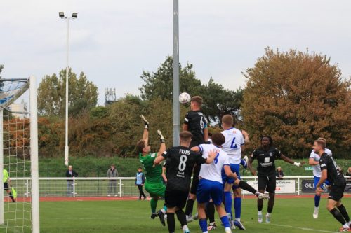 IMG 1437-Apparently-Enfields-Henry-Hawkins-somewhere-in-the-group-of-players-has-beaten-Luke-Haines-6-to-the-ball-which-loops-into-the-net-for-the-only-goal