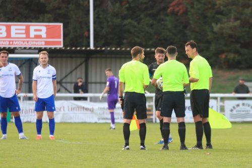 IMG 1623-The-officials-gather-to-decide-what-action-to-take-after-a-brief-flare-up