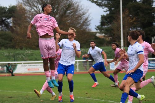 IMG 2471-Eastbournes-Tayt-Trusty-cant-get-his-head-to-the-ball-which-makes-its-way-to-Herny-Hawkins-who-scores-the-opening-goal