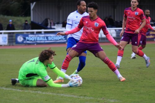 IMG 3407-Tonbridge-keeper-Laurie-Shala-is-protected-by-Kyle-Smith-as-he-collects-the-ball-ahead-of-Lamar-Reynolds