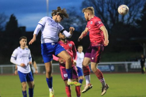 IMG 3574-Sam-Youngs-R-wins-a-header-against-Matty-Warren