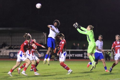 IMG 4926-Dorking-keeper-Harrison-Foulkes-claims-the-ball-ahead-of-Eli-Ackason