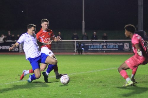 IMG 2275-Tommy-Wood-L-and-Maxx-Manktelow-challenge-for-the-ball.-The-move-ended-with-Manktelow-hitting-his-own-post-in-trying-to-clear