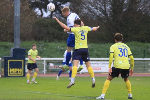 IMG 3109-Cian-Dillon-beats-Ollie-Robinson-to-get-a-header-on-goal