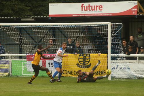 'Keeper Nathan McDonald saves a cross-shot from Cheshunt's Theo Osinfolarin (not in photo)