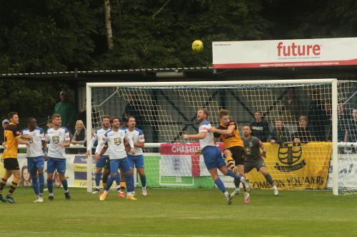 Enfield's Adam Cunnington heads clear