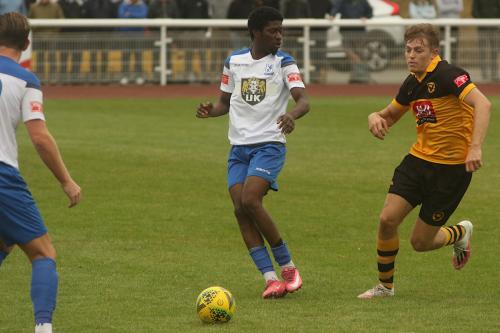 Enfield's Andre Coker receives the ball
