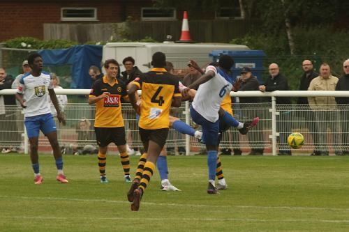 Jerry Gyebi (6) gets a shot in