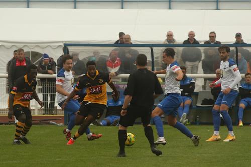 Enfield's (L to R) Lewis Taaffe, Sam Youngs & Josh Urquhart, and Cheshunt's Reece Beckles-Richards (centre) and Zubayr Bodie (L)