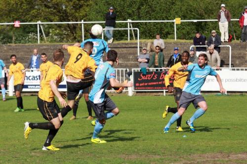 Enfields-Liam-Hope-blue-9-flicks-the-ball-on-for-Ryan-Doyle-to-score-the-winning-goal