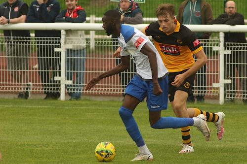 Town's Mo Faal and Cheshunt's Adam Crowther