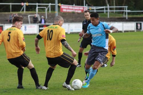 Enfields-Nathan-Livings-blue-is-tackled-by-Adrian-Stone