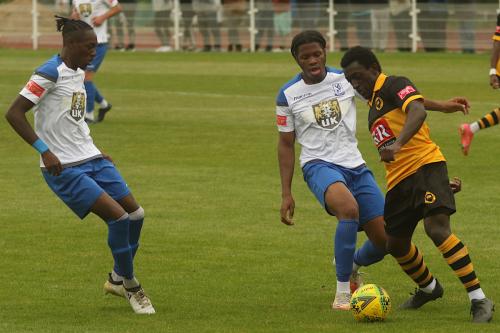 Enfield's Nathan-Smith (L) & Manny Maja (R) and Cheshunt's Zubayr Bodie.
