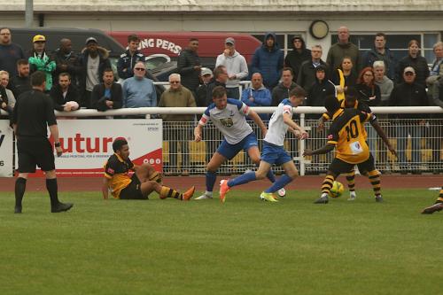 Enfield's Ryan Kirwan (R) sets off down the left flank