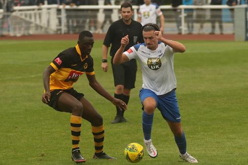 Town's Sam Youngs and Cheshunt's Mo Camara