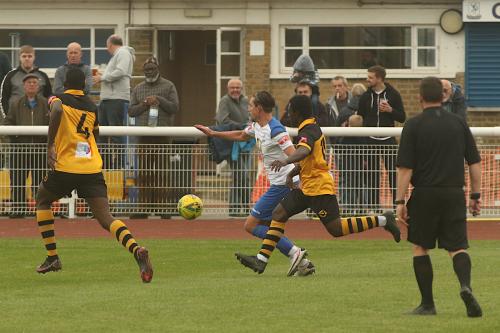 Enfield's Sam Youngs and Cheshunt's Zubayr Bodie (R) & Mo Camara (L)