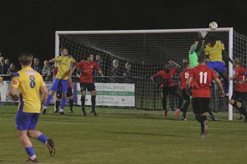 Hadley-keeper-Luke-Ward-catches-the-ball-under-pressure-from-Enfields-Jerry-Gyebi.
