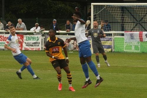 Jerry Gyebi heads clear from Cheshunt's former Towner Ken Charles