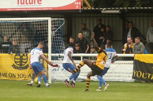 Nathan McDonald saves Mo Camara's effort