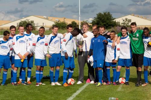 Enfield Town's squad celebrate with the cup